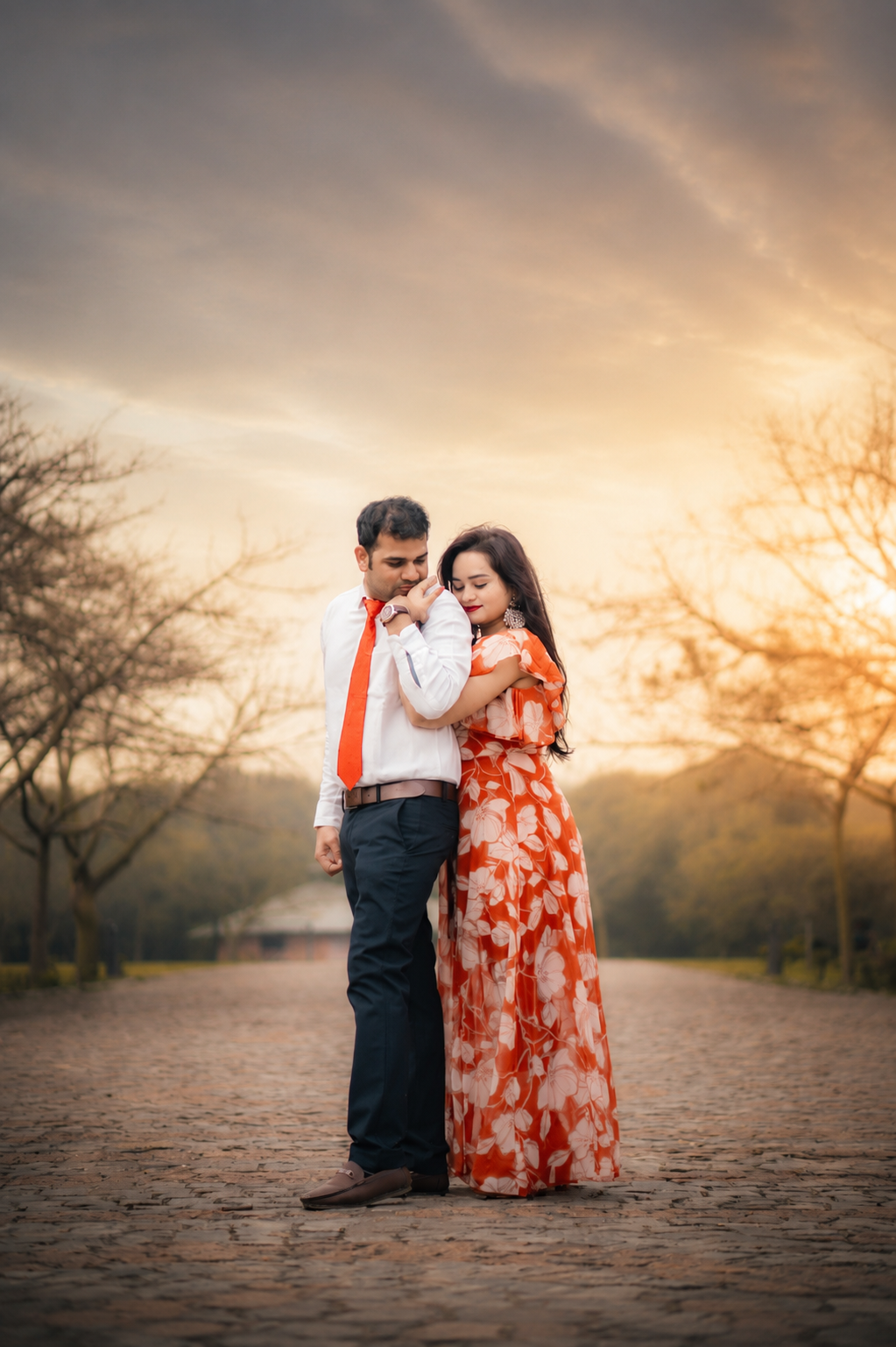 Dharmendra kissing Sarita's hand on a cobbled path at sunset