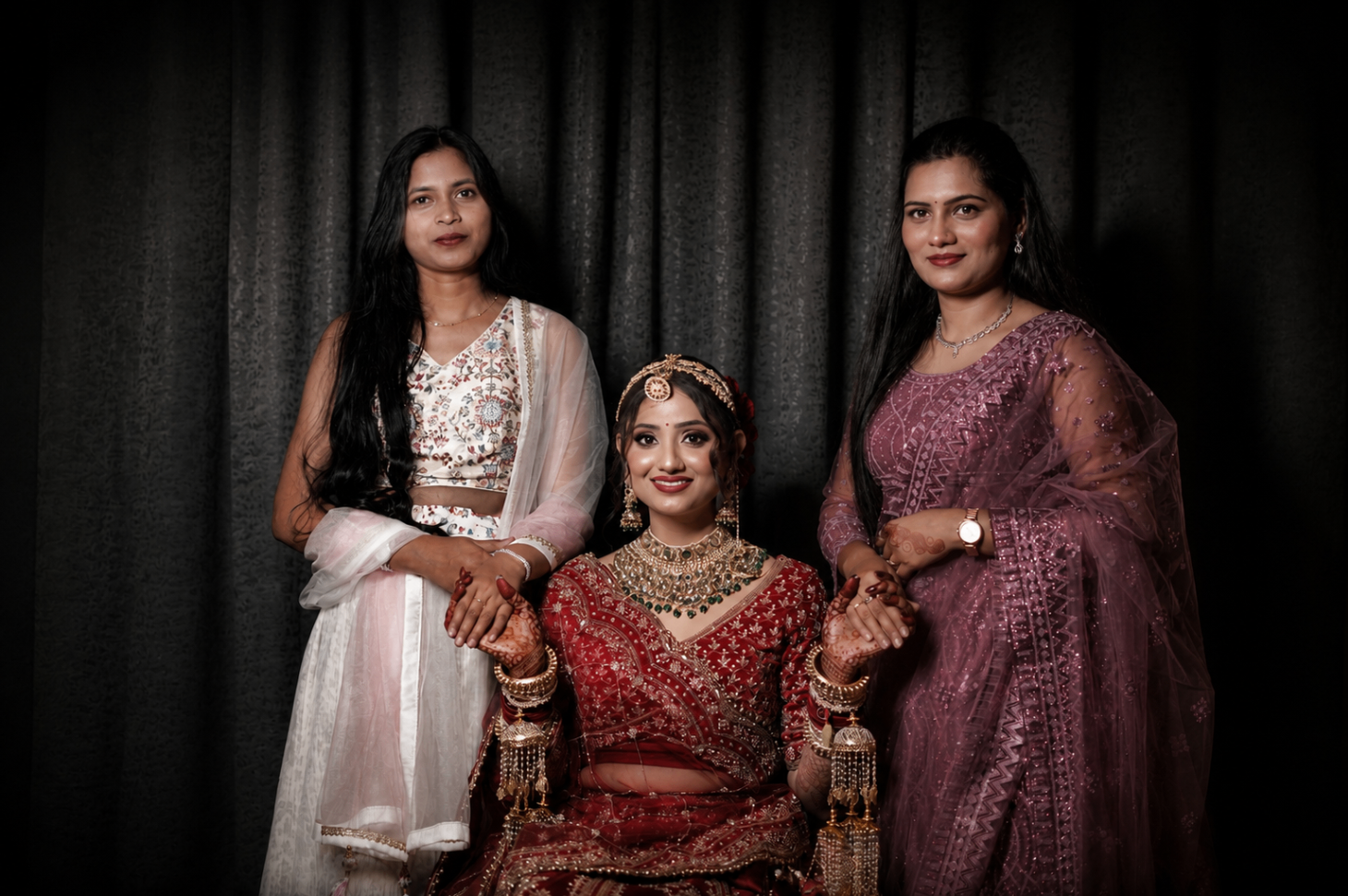 Vaishnavi seated with her sisters — three portraits, one quiet bond