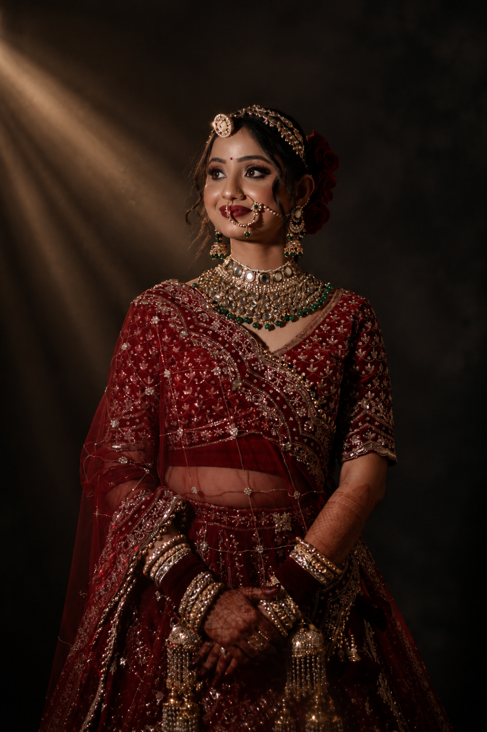 Studio portrait — Vaishnavi turned toward the light, kundan catching gold