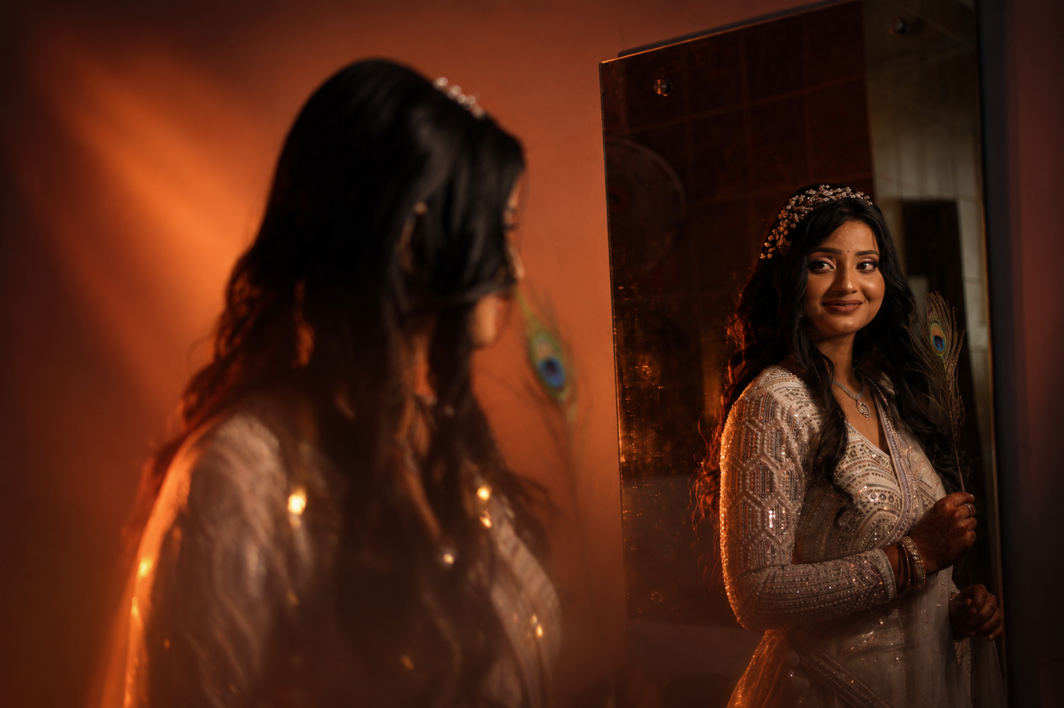 Getting ready in Lucknow — Vaishnavi at the mirror, peacock feather in hand, warm lamplight around her